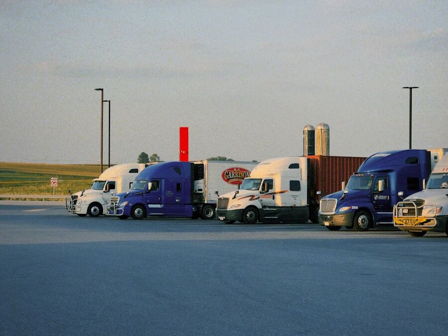 Row of semi trucks in parking lot